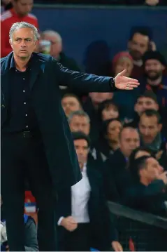  ??  ?? Valencia trouble: Jose Mourinho and Antonio Valencia speak during Manchester United’s draw against Valencia