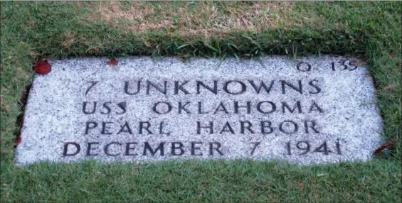  ?? AUDREY MCAVOY — THE ASSOCIATED PRESS FILE ?? The National Memorial Cemetery of the Pacific in Honolulu displays a gravestone identifyin­g it as the resting place of seven unknown people from the USS Oklahoma who died in Japanese bombing of Pearl Harbor. More than 75 years after nearly 2,400 members of the U.S. military were killed in the Japanese attack at Pearl Harbor some who died on are finally being laid to rest in cemeteries across the United States. After DNA allowed the men to be identified and returned home, their remains are being buried in places such as Traer, Iowa and Ontonagon, Michigan.