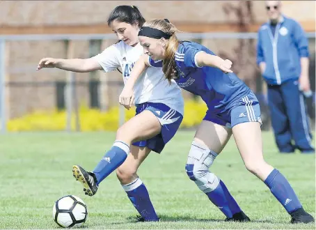  ?? NICK BRANCACCIO ?? Jenna McConnell, right, of the Villanova Wildcats leans into Katerina Iakovidis of the St. Anne Saints during the WECSSAA senior girls’ triple-A final at McHugh Park on Wednesday. The Wildcats jumped out to a quick 2-0 lead and made it stick in an...