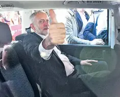  ??  ?? Mr Corbyn gives a thumbs up from his car during his visit to Glasgow