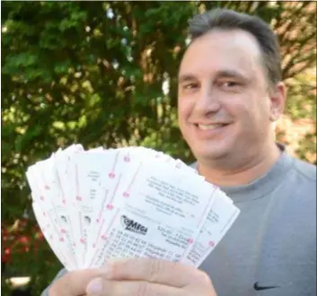  ?? PETE BANNAN - DIGITAL FIRST MEDIA ?? Randy Testa of Havertown holds $2,600 of Mega Millions lottery tickets.