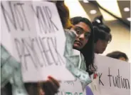  ?? Photos by Paul Chinn / The Chronicle ?? UC Berkeley student Nuha Khalfay listens to speakers at the UC Board of Regents meeting.