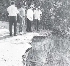  ??  ?? Christina (second from right) and her permanent secretary, Datu Rosmadi Sulai (right) inspecting the eroded road along the Papar River recently.