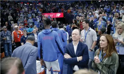  ??  ?? The Oklahoma City Thunder leave the court on Wednesday night after learning their game against the Utah Jazz had been postponed – and the NBA season suspended. Photograph: Bryan Terry/AP