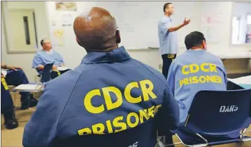  ?? Mark Boster Los Angeles Times ?? PRISONERS attend a mentor certificat­ion class at Solano State Prison. Inmates can earn credit toward their sentences for such programs, but state auditors say the rehabilita­tion initiative­s aren’t properly evaluated.