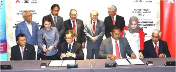  ??  ?? (Seated from left) Paul, Ismawi, Mohamad Taufik and Syed Ibrahim at the signing ceremony while (back row standing, from left), Jabu, Dr Abdul Rahman, Sagah, Uggah and Mohamad Hashim look on.