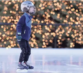  ?? ADAM WESLEY/USA TODAY NETWORK-WISCONSIN ?? Ben Renkas, 6, of De Pere, skates past the Christmas tree on the ice skating pond in Titletown. The park is part of the Green Bay Packers' Titletown District in Ashwaubeno­n.