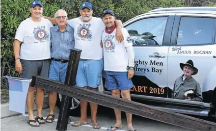  ?? Picture: ROB KNOWLES ?? MIGHTY MEN AND THE CROSS: From left, Martin Douglas (wingman), local liaison officer Dawie Louw, Derek Grobbelaar (wingman) and cross carrier Reini Coetzee, who are taking the huge wooden cross all the way from Gonubie to Jeffreys Bay on or before March 8 at the start of the 2019 Mighty Men conference