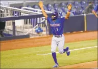  ?? Lynne Sladky / Associated Press ?? The Mets’ Amed Rosario reacts as he runs the bases after hitting a solo home run against the Marlins during the seventh inning Tuesday.