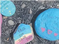  ??  ?? Painted rocks randomly placed and found on a recent walk lend a feel-good vibe during a trying time.