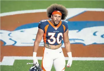  ?? Justin Edmonds, The Associated Press ?? Broncos running back Phillip Lindsay walks on the field before taking on the Tennessee Titans on Monday night. Lindsay suffered a toe injury in the season opener.