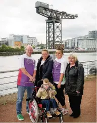  ??  ?? Charity glide Joseph Donnelly with wife Joanne, stepdaught­er Lauren McGugan, family member Mary McGuire and son Jack