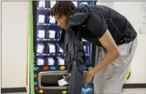  ?? ?? Computer science student Yaacob Fikre gets a box of Narcan from the vending machine on campus. Students say the availabili­ty is an important step in addressing the fentanyl crisis.