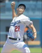  ??  ?? WALKER BUEHLER collected eight strikeouts in 51⁄3 solid innings en route to earning his fifth victory for the Dodgers.