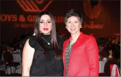  ?? (NWA Democrat-Gazette file photo/Carin Schoppmeye­r) ?? Silvia Azrai-Kawas and Marybeth Hays welcome guests to the 2018 Youth of the Year Celebratio­n.