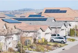  ?? RICH PEDRONCELL­I/ AP 2020 ?? California is considerin­g reforms that would reduce financial incentives for homeowners who install solar panels. Above, panels on homes in Folsom, Calif.