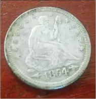  ?? FRAN MAYE — DIGITAL FIRST MEDIA ?? This is the extremely rare 1854 Arrows Liberty Seated Quarter found by Danny Johnson.