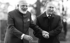  ?? PHOTO: REUTERS ?? DIVERGENT VIEW Prime Minister Narendra Modi and Russian President Vladimir Putin at the St Petersburg Economic Forum on June 1. India sees its ties with Russia through the lens of its bilateral disputes with China and Pakistan; Russia views them...