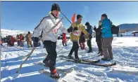  ??  ?? Visitors try traditiona­l Kazakh wooden skis at Hemu village in Altay prefecture, Xinjiang Uygur autonomous region.