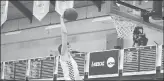  ?? SHAWN MCFARLAND/HARTFORD COURANT ?? Glastonbur­y’s Jack Shea jumps for the dunk against Bloomfield at the Doc Hurley Classic.