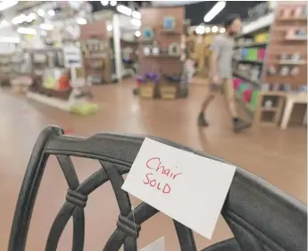  ?? JULIO CORTEZ/AP ?? The sign on a patio furniture floor model at Valley View Farms in Cockeysvil­le, Maryland, shows it’s sold. And good luck finding more.