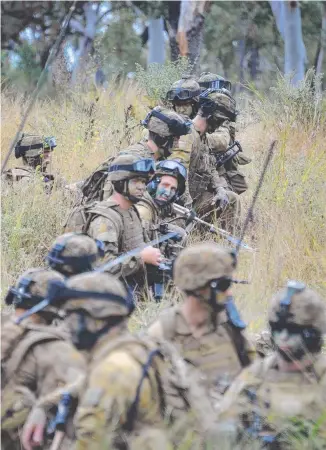  ??  ?? MILITARY ACTION: Australian Army soldiers at the Townsville Field Training Area.