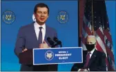  ?? KEVIN LAMARQUE — POOL VIA AP ?? Former South Bend, Ind. Mayor Pete Buttigieg, Presidente­lect Joe Biden’s nominee to be transporta­tion secretary, speaks as Biden looks on during a news conference at The Queen theater in Wilmington, Del., Wednesday.