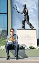  ??  ?? Immortalis­ed: Andy Murray poses in front of the Fred Perry statue in 2013