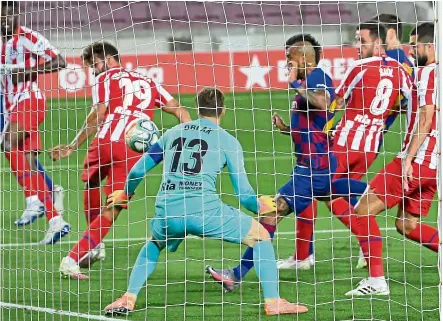  ?? afp ?? Accidental assist: costa (no. 19) diverts Messi’s corner into the net for Barcelona’s opening goal. atletico Madrid fought back to secure a 2-2 draw at nou camp. —