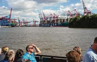  ?? Patrick Junker / New York Times ?? A cargo ship fueled by liquefied natural gas passes by in Germany. Tree Energy Solutions’ Marco Alverá plans to produce “green gas” from hydrogen using existing infrastruc­ture.