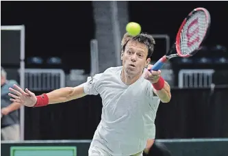  ?? JON BLACKER THE CANADIAN PRESS ?? Daniel Nestor returns a shot from the team of Matwe Middelkoop and Jean-Julien Rojer of the Netherland­s in Davis Cup tennis action in Toronto on Saturday. Nestor, with doubles partner Vasek Pospisil, lost in four sets.