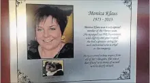  ?? HO THE CANADIAN PRESS ?? A plaque rememberin­g the lives of Monica and the family dog Patches hangs on a wall at Vortex Production Services, in Settler, Alta.