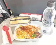  ??  ?? HIDANGAN menu semasa penerbanga­n AirAsia. yang boleh didapati Chicken Teriyaki