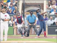  ?? JUSTIN EDMONDS — GETTY IMAGES ?? Even NL pitcher Corbin Burnes, left, is impressed by Vladimir Guerrero Jr.’s 468-foot homer in Tuesday’s All-Star Game.