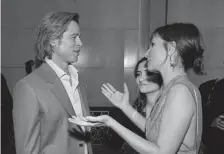  ?? Robyn Beck, AFP/Getty Images ?? Actor Brad Pitt talks with Brazilian actress/filmmaker Petra Costa during the 2020 Oscars Nominees Luncheon at the Dolby theatre in Hollywood on Jan. 27.