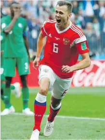  ??  ?? Russia’s Denis Cheryshev celebrates after scoring against Saudi Arabia in Moscow on Thursday.