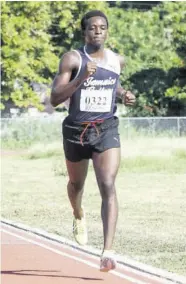  ?? (Photos: Dwayne Richards) ?? Matthew Gordon of Jamaica College winning the first event on the track, the 5000m Open, in 17:08.97 minutes at the Tyser-mills Classics at Calabar High School on Saturday.