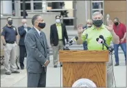  ?? BEN HASTY — MEDIANEWS GROUP ?? Hector Dorta, left, and Berks County Commission­er Christian Y. Leinbach stand together at the podium during a press conference about the coronaviru­s in front of the Berks County Services Center on Aug. 10. Officials addressed the need for people to wear masks to prevent the spread of COVID-19.