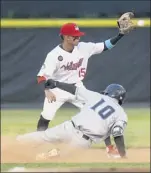  ?? Hans Pennink / Special to the times union ?? Hudson Valley’s tanner dodson slides in safely at second base in front of tri-city shortstop deury Carrasco.