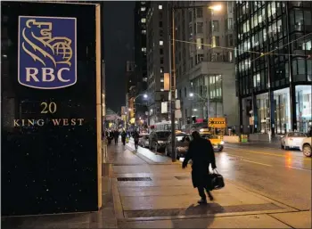  ?? — THE CANADIAN PRESS FILES ?? RBC shares slipped 61 cents to $72.09 Wednesday, even though quarterly dividends will increase by six per cent to 71 cents a common share.