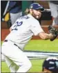 ?? L. A. Times ?? Robert Gauthier CLAYTON KERSHAW records an out in his victory in Game 1.