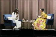  ?? PHOTO BY WILLY SANJUAN — INVISION — AP ?? Former first lady Michelle Obama, left, and Tracee Ellis Ross speak at the “Becoming: An Intimate Conversati­on with Michelle Obama” event at the Forum on Thursday in Inglewood