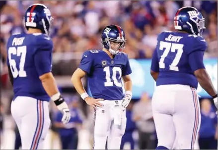  ?? ELSA/GETTY IMAGES NORTH AMERICA/AFP ?? Eli Manning, #10 of the New York Giants, looks on in the fourth quarter against the Detroit Lions during their game at MetLife Stadium on September 18 in East Rutherford, New Jersey.