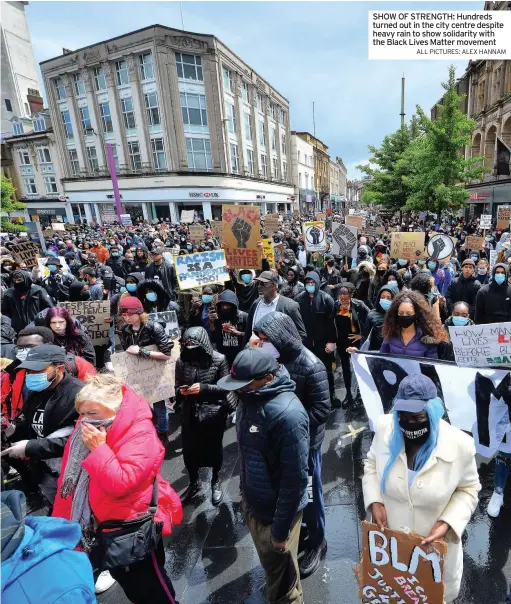  ?? ALL PICTURES: ALEX HANNAM ?? SHOW OF STRENGTH: Hundreds turned out in the city centre despite heavy rain to show solidarity with the Black Lives Matter movement