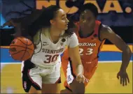  ?? MORRY GASH — THE ASSOCIATED PRESS ?? Stanford guard Haley Jones, left, drives up court ahead of Arizona guard Bendu Yeaney on Sunday at the Alamodome.