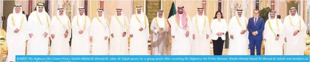  ?? — Amiri Diwan ?? KUWAIT: His Highness the Crown Prince Sheikh Mishal Al-Ahmad Al-Jaber Al-Sabah poses for a group photo after receiving His Highness the Prime Minister Sheikh Ahmad Nawaf Al-Ahmad Al-Sabah and members of his Cabinet at Bayan Palace.