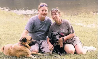  ?? AMY HUNTER ?? John and Amy Hunter with Apollo and Rubi. The couple’s two sons died and their daughter will soon graduate from college. Amy is home full time with the dogs. “(Rubi has) been my emotional saviour,” she says.