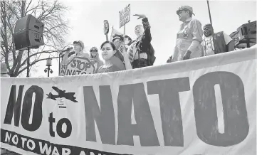  ??  ?? Activists rally in Lafayette Square to protest ahead of the 70th anniversar­y of the summit meeting of the Nato in Washington, DC. — AFP photo