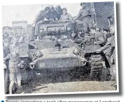  ??  ?? ●●People inspecting a tank after maneouvres at Lanehead