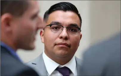  ?? The Associated Press ?? AQUITTED: In this May 30 photo, St. Anthony police officer Jeronimo Yanez stands outside the Ramsey County Courthouse while waiting for a ride in St. Paul, Minn.